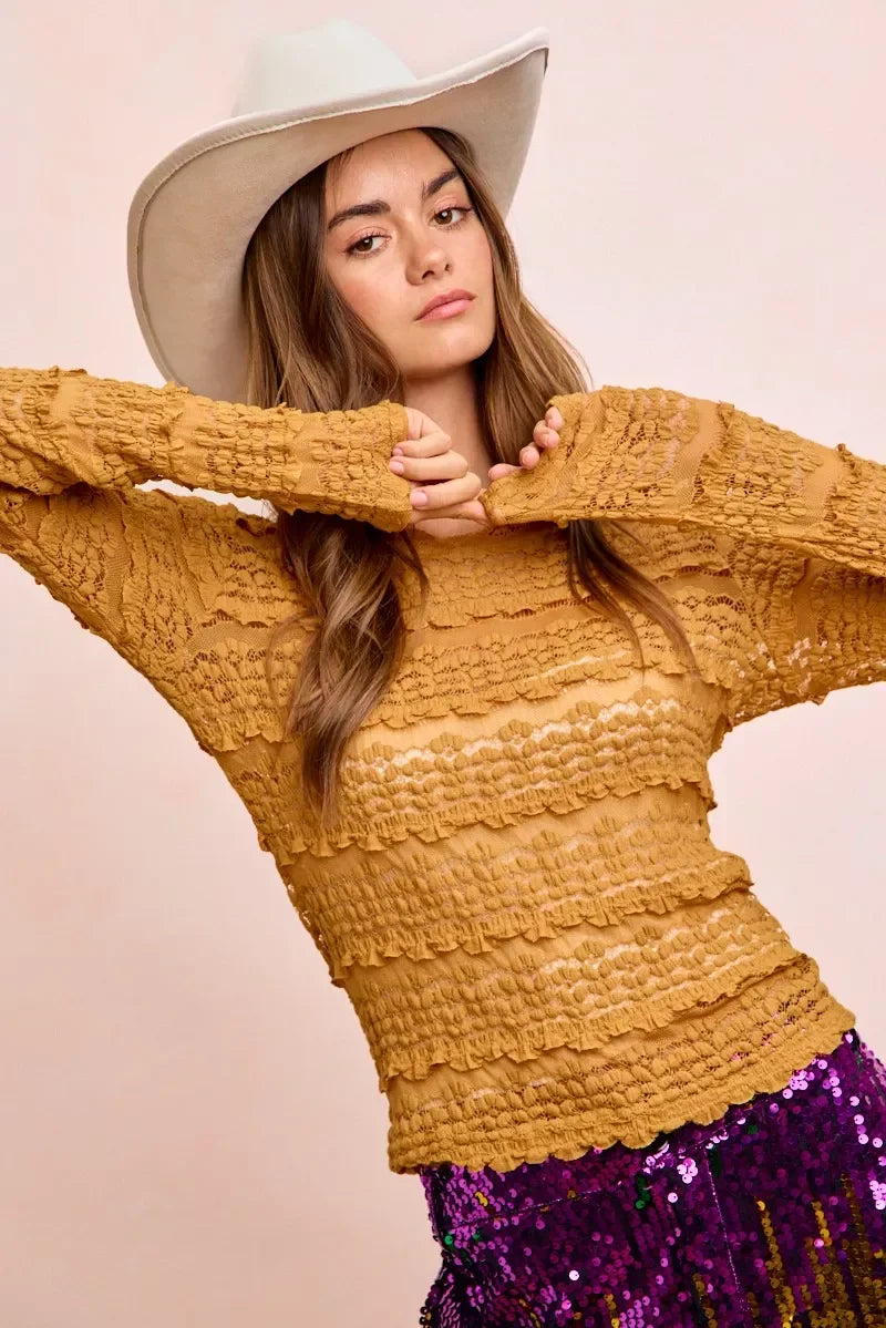 Mustard yellow textured sweater with scalloped hem and wide-brimmed hat