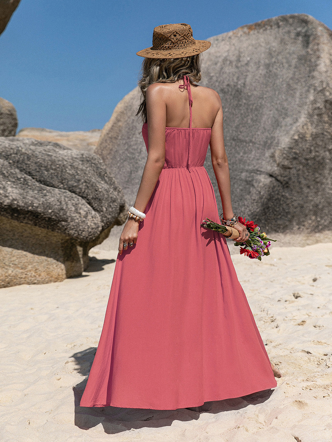 Coral halter-neck maxi dress with fitted waist, back tie, and v-neck buttons