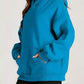 Vibrant teal kangaroo pocket long sleeve hoodie with relaxed fit
