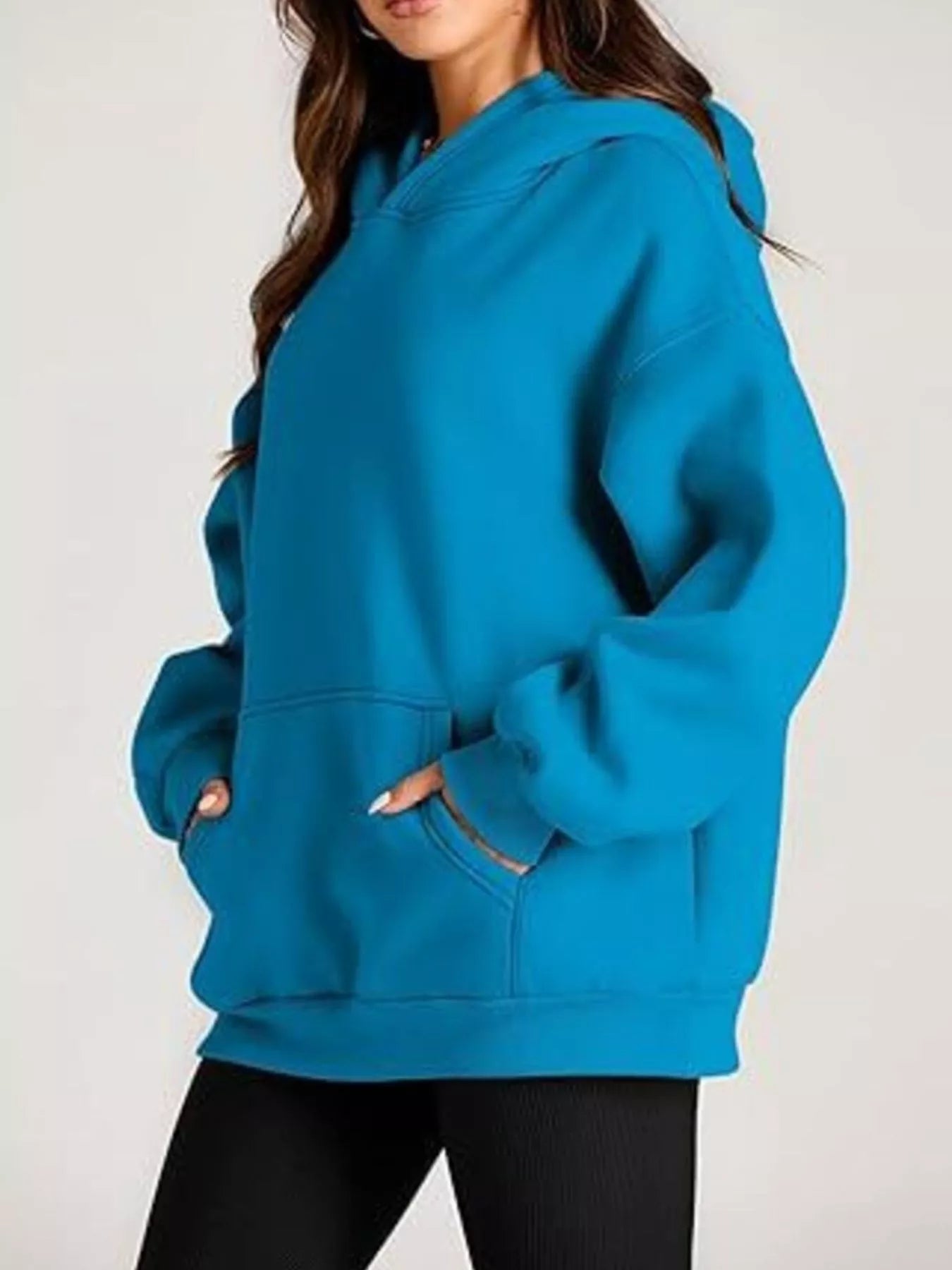 Vibrant teal kangaroo pocket long sleeve hoodie with relaxed fit