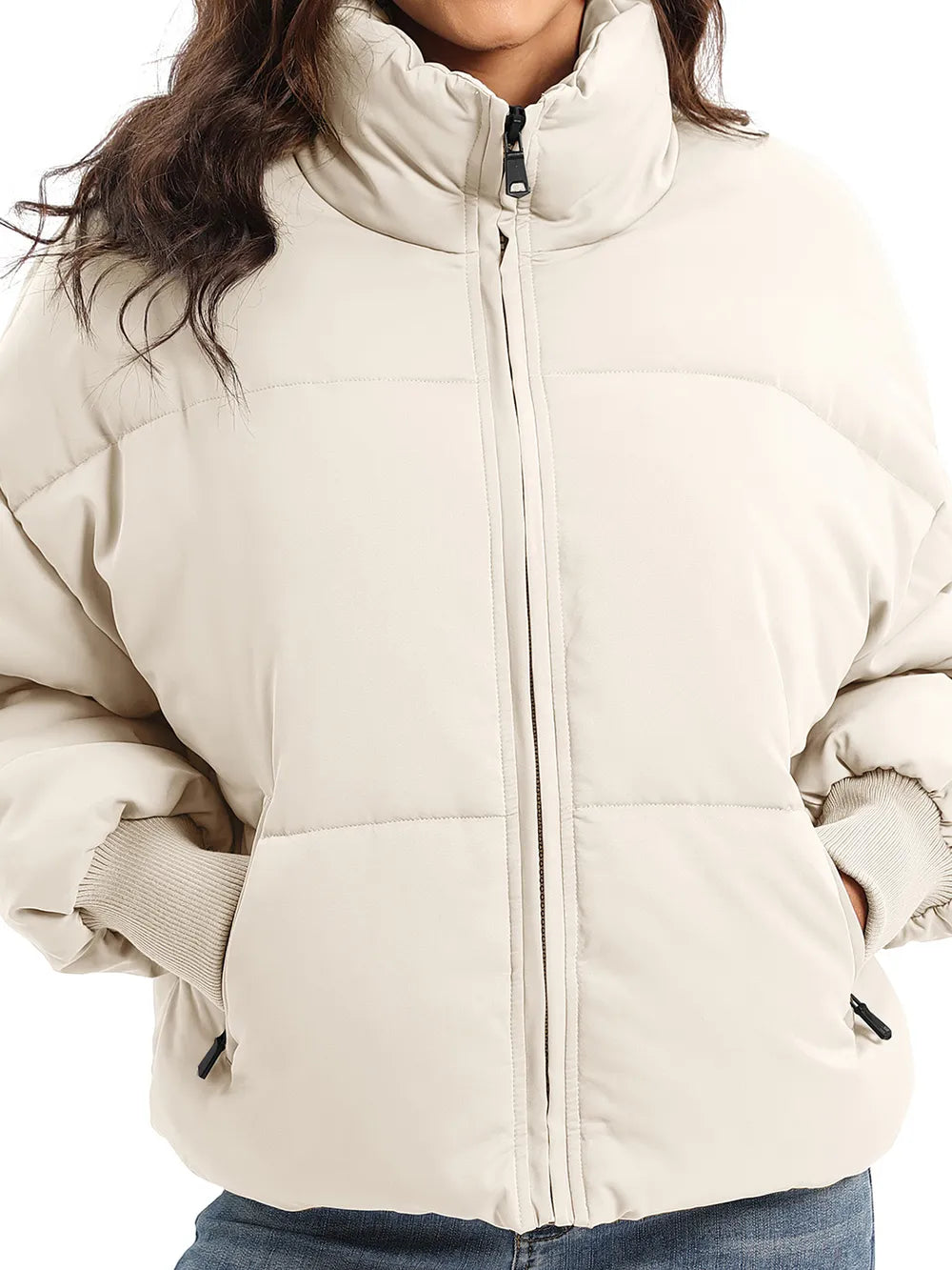 Cream zip-up turtleneck long sleeve puffer jacket with black zipper pockets