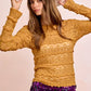Mustard yellow textured sweater with fringed ruffle details