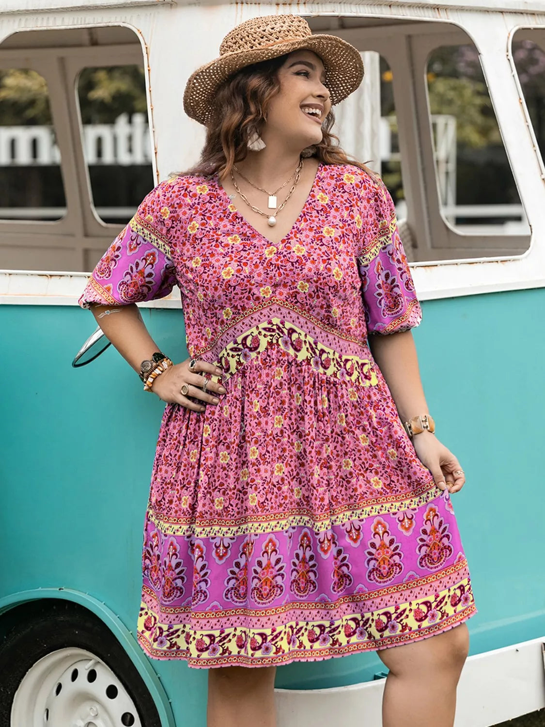 Plus size floral v-neck mini dress in pink purple print