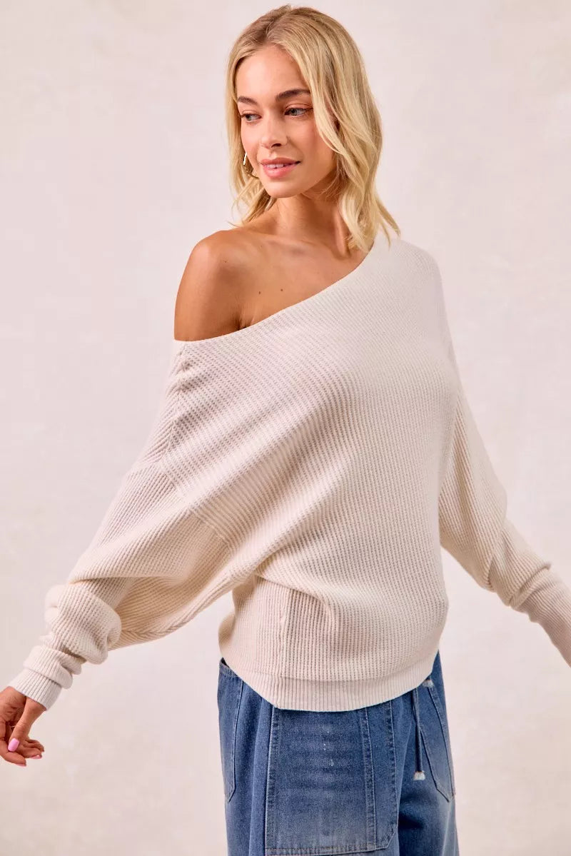 Cream-colored ribbed BiBi waffle knit off-shoulder top with flowing sleeves