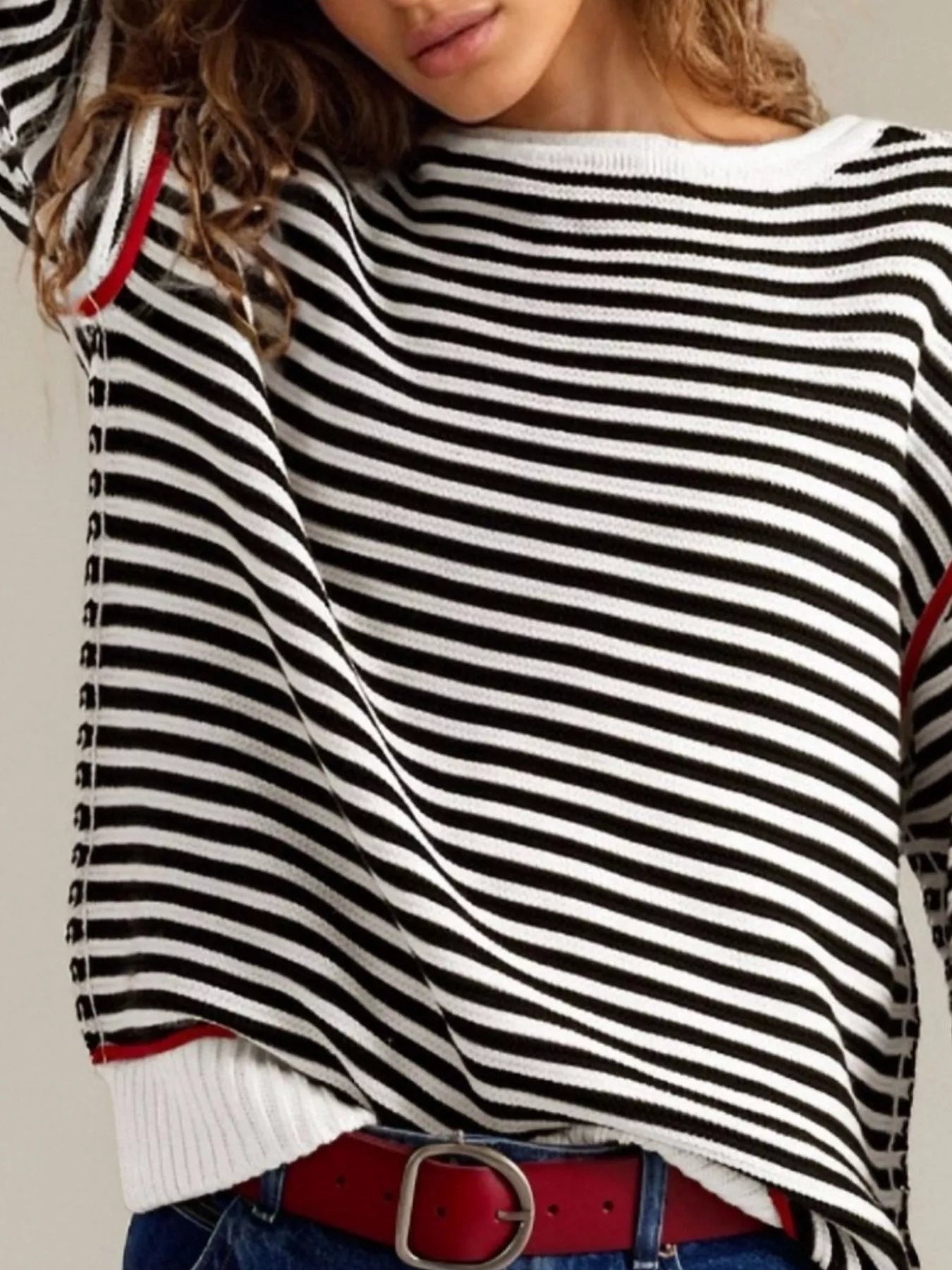 Black and white striped round neck long sleeve sweater with red trim