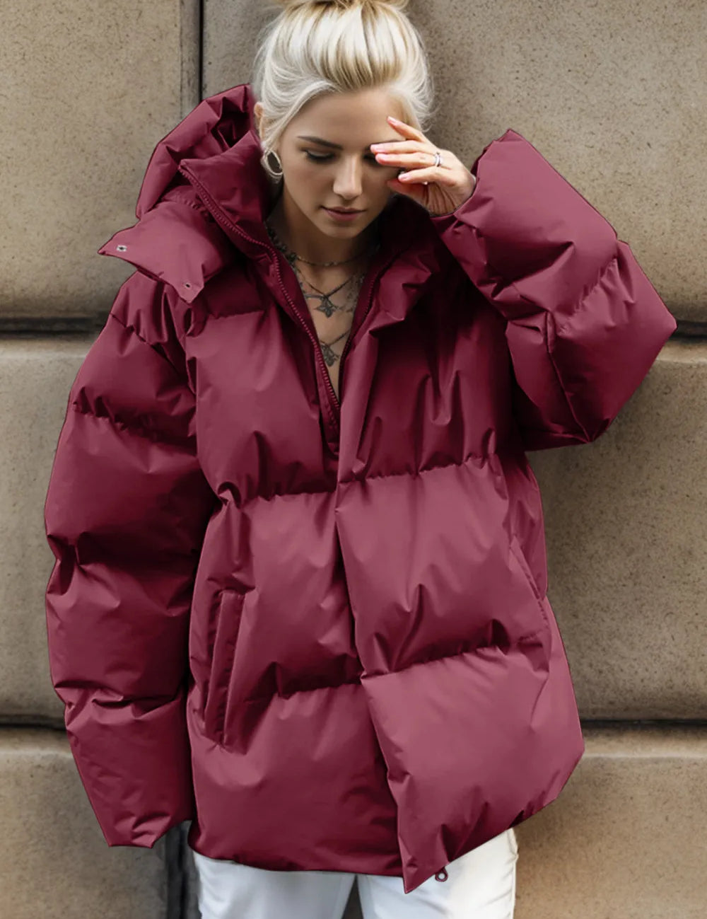 Burgundy oversized hooded puffer jacket with zipper and pockets