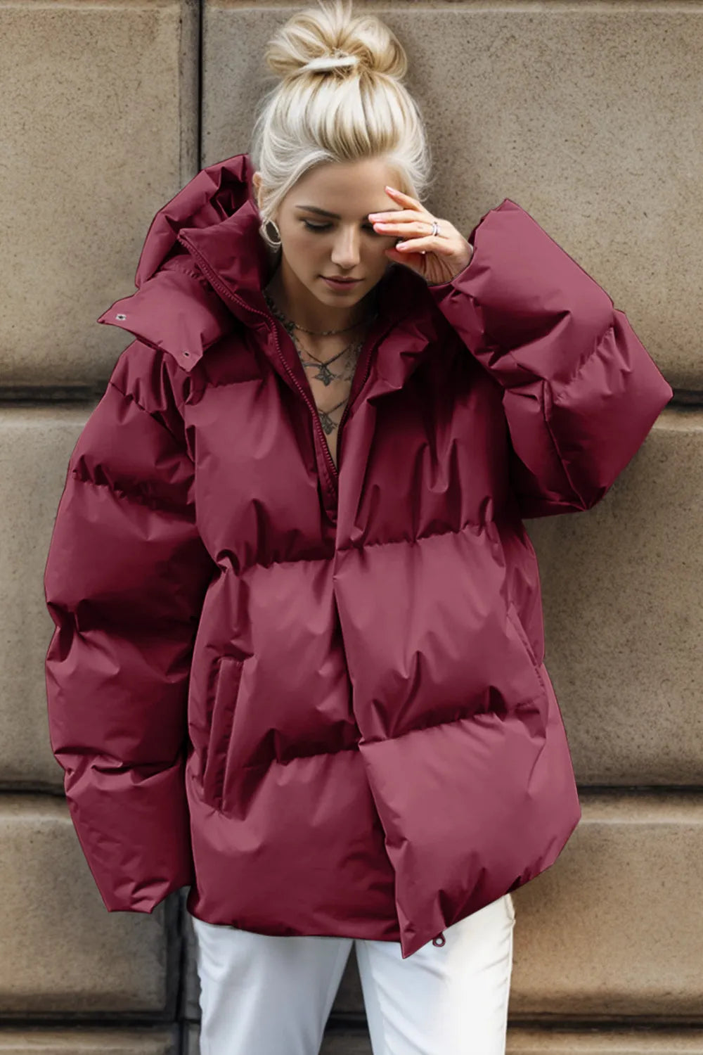 Burgundy oversized hooded puffer jacket with zipper and pockets