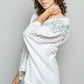 POL Floral Star Patch hooded blouse in light blue with floral shoulders and ruffled sleeves