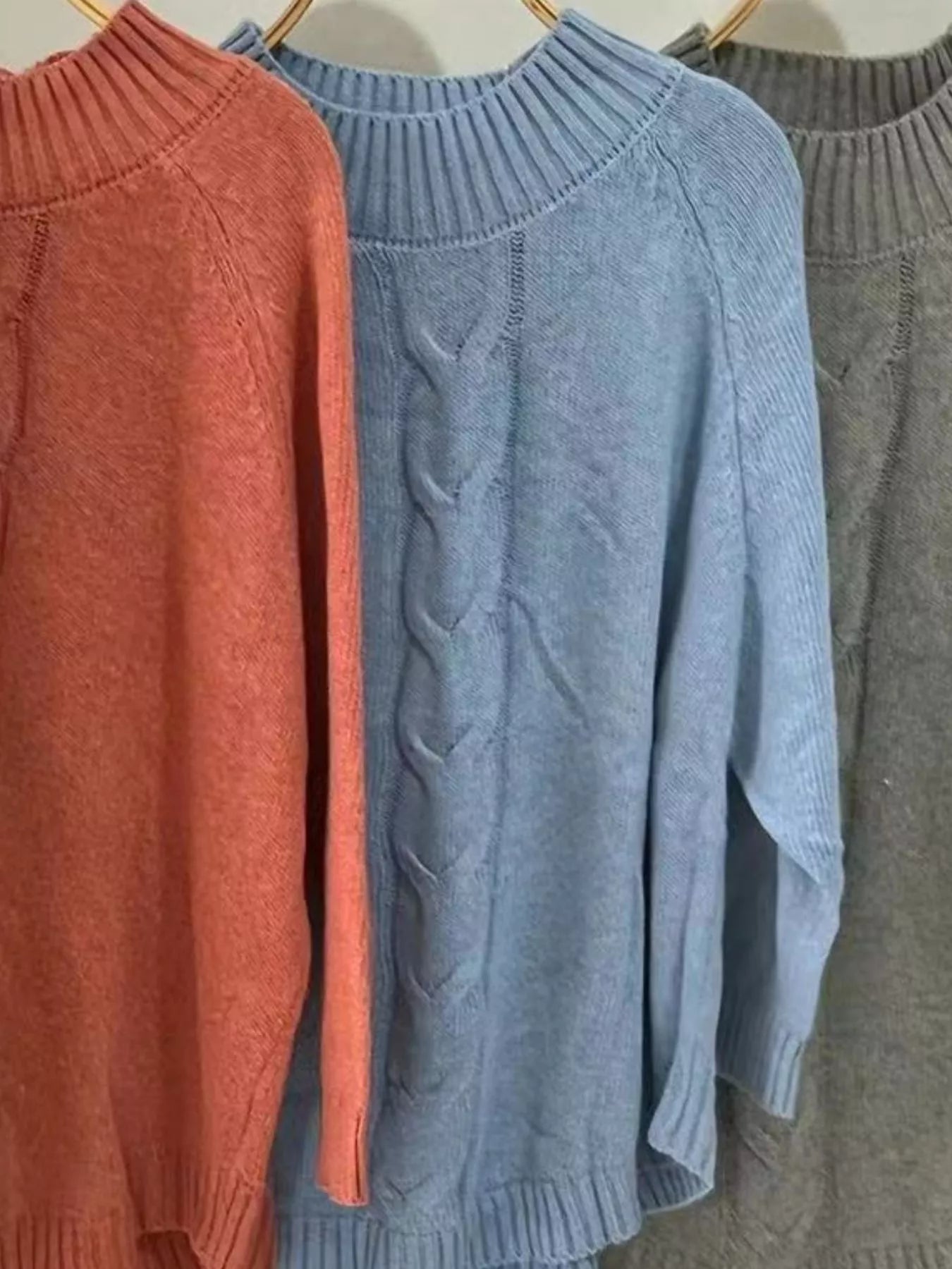 Soft blue cable-knit plus size sweater with turtleneck sleeves