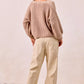 Cozy beige ribbed knit sweater with balloon sleeves over BiBi Drawstring Striped Twill Barrel Pants Oatmeal
