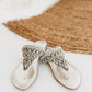 Silver Loving U thong sandals with beaded leaf detailing
