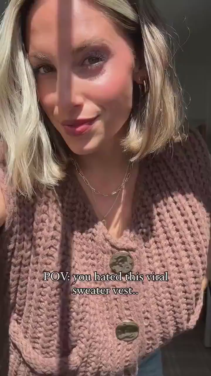 Woman in a video wearing sleeveless cardigan sweater vest